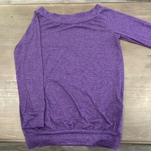 Purple long sleeve woman’s top with a boatneck collar size small